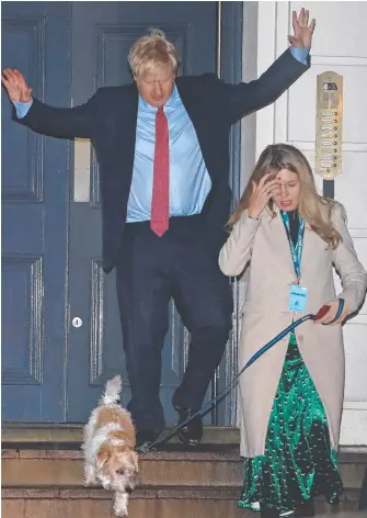  ?? Picture: AP Photo ?? Boris Johnson leaves Conservati­ve Party headquarte­rs with his partner Carrie Symonds and their dog Dilyn yesterday and (inset) Labour Leader Jeremy Corbyn.