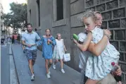  ?? Giannis Papanikos / Associated Press ?? People flee the Las Ramblas district in Barcelona, Spain, on Thursday after a van drove into a crowd.