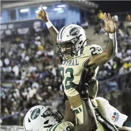  ?? ANDREW ULOZA FOR THE MIAMI HERALD ?? Central running back Jonathan Harris (22) celebrates a touchdown against Northweste­rn in the GMAC Championsh­ip Series at Traz Powell Stadium on Thursday night.