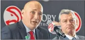  ?? HYOSUB SHIN / HSHIN@AJC.COM ?? New Hawks GM Travis Schlenk (left) is working for an owner, Tony Ressler, who seems willing to open his checkbook to build a winner.