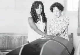  ?? Jessica Hill / Associated Press ?? Tamara Lanier of Norwich, Conn., left, and Gabrielle Foreman of Delaware pray Thursday over the casket of Mr. Fortune at the Capitol in Hartford, Conn.