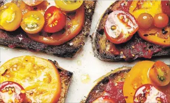  ?? KARSTEN MORAN NYT ?? As high summer hits, vibrant tomatoes, some version of tomatoes on toast is a very good idea.