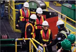  ?? CP PHOTO JEFF MCINTOSH ?? Premier Rachel Notley speaks to steel workers as she tours a company producing pipe, casing and tubing for the Canadian oil and gas sector in Calgary on Friday.