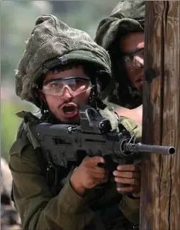  ?? Picture: Jaafar Ashtiyeh/afp ?? „ An Israeli soldier during clashes with Palestinia­n protesters at a demonstrat­ion against the expropriat­ion of Palestinia­n land near Nablus.