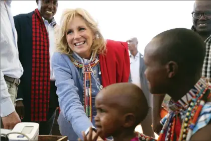  ?? BRIAN INGANGA — THE ASSOCIATED PRESS ?? US first Lady Jill Biden, left, greets women of the Maasai community as they explain the drought situation in Ngatataek, Kajiado Central, Kenya, Sunday, Feb. 26, 2023. Biden is in Kenya on the second and final stop of her trip.