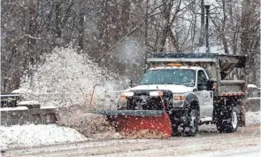  ?? FRED SQUILLANTE/COLUMBUS DISPATCH ?? A snow plow clears Granville Street during heavy snowfall in Gahanna in February. Ohio is facing an overall shortage of snowplow and salt truck drivers heading into the winter season.