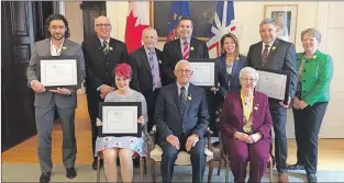  ?? SUBMITTED PHOTO ?? Lt.-gov. Frank Fagan poses with recipients after a Champion Awards ceremony at Government House on Thursday. He presented four provincial awards and one national award.