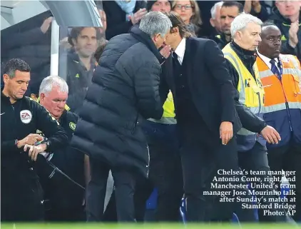  ??  ?? Chelsea’s team manager Antonio Conte, right, and Manchester United’s team manager Jose Mourinho talk after Sunday’s match at Stamford Bridge Photo: AP