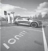  ?? CHRISTOPHE­R FURLONG/GETTY ?? A Hyundai Ioniq battery electric vehicle charges at an Ionity Gmbh electric car charging station April 26 in Leeds, England.