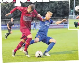  ??  ?? Holyhead’s Caio Hywel skips over this challenge by Bangor City’s Marc Williams.