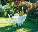  ??  ?? Left to right: A sunny garden spot beckons; cottage garden favourite Lychnis coronaria ‘Alba’; relaxing in the warmth; dense spikes of Veronicast­rum virginicum ‘Fascinatio­n’.