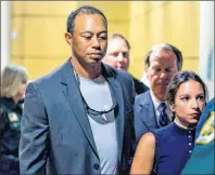  ?? AP PHOTO ?? Golfer Tiger Woods leaves the Palm Beach County Courthouse, in Palm Beach Gardens, Fla., Friday, after pleading guilty to a charge of reckless driving in connection with his May arrest for driving under the influence.