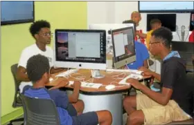  ?? CONTRIBUTE­D PHOTO ?? Area youth learn how to code apps at Middlesex Community College’s programmin­g camp in Middletown.