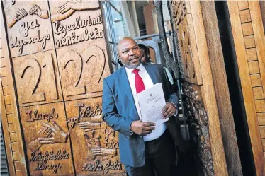  ?? Picture: ALAISTER RUSSELL ?? PAID TO GO: Former NPA head Mxolisi Nxasana talks to journalist­s at the Constituti­onal Court in Johannesbu­rg on Monday. The court ruled that the appointmen­t of Shaun Abrahams as NPA head was unconstitu­tional and invalid