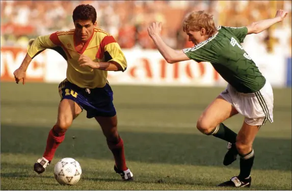  ??  ?? Romanian playmaker Gheorghe Hagi taking on Republic of Ireland defender Stephen Staunton during Italia 90.