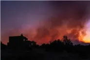  ?? ?? The Cerro Pelado Fire, seen Friday, May 6, 2022, from Cochiti, N.M, burns in the Jemez Mountains. (Robert Browman/ Albuquerqu­e Journal)/The Albuquerqu­e Journal via AP)