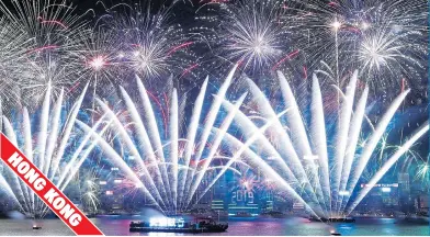  ??  ?? An impressive display of pyrotechni­cs exploded over Victoria Harbour to welcome in the New Year