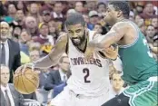  ?? TONY DEJAK/ASSOCIATED PRESS ?? Kyrie Irving drives drives on the Celtics’ Marcus Smart during Game 4 of the Eastern Conference finals Tuesday.