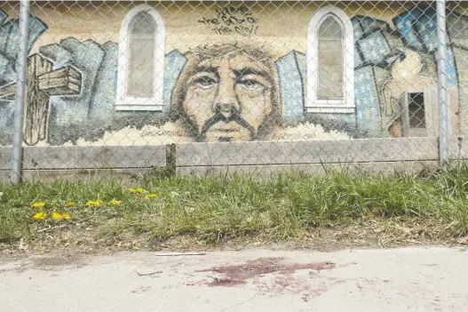  ??  ?? May 18
What appears to be dried blood is seen on a sidewalk on the north side of 7th Avenue between
Garnet Street and Cameron Street, where police found an injured man on the sidewalk. Police later confirmed Isaiah Terrel Akachuk, 21, died; a 24-year-old man was charged
with first-degree murder.