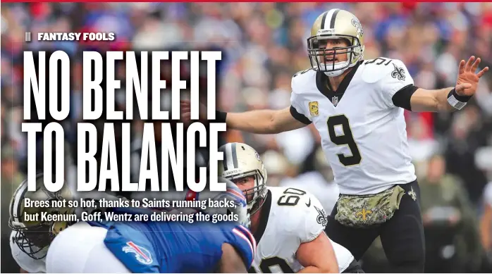  ?? | BRETT CARLSEN/ GETTY IMAGES ?? Drew Brees is a quarterbac­k every fantasy owner wants— unless he’s not the most potent part of his offense. The Saints had six rushing TDs, including one by Brees, in Sunday’s win over the Bills.