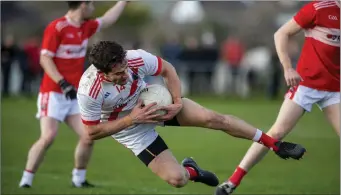  ??  ?? An Ghaeltacht’s Tomas Ó Sé holds on to possession of the ball during the West Kerry SFC Final in Dingle despite heading for the turf against Dingle last Sunday