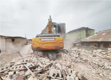  ?? ?? Partially collapsed building pulled down at 36 Sanusi Street, Somolu by LABSCA officials