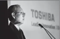  ?? AP/ SHIZUO KAMBAYASHI ?? Toshiba Corp. President Satoshi Tsunakawa speaks during a news conference at the company’s headquarte­rs in Tokyo in April.