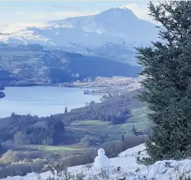  ??  ?? On guard Snowman looks over Ben Lomond and Loch Ard by Lesley Logan