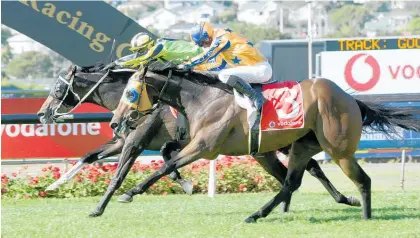  ?? Photo / Trish Dunell ?? Crown Prosecutor springs a massive upset at $105 to one, narrowly beating In A Twinkling in the $1 million Vodafone NZ Derby at Ellerslie on Saturday.