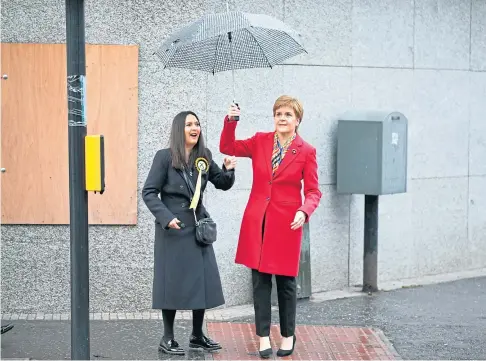  ??  ?? ‘RECKLESS’: Covid-breach MP Margaret Ferrier, left, with First Minister Nicola Sturgeon who has asked her to resign.