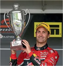  ?? PHOTO: GETTY IMAGES ?? Jamie Whincup with the spoils of victory.