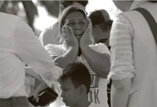  ?? Jerry Lara / Staff file photo ?? Catalina Peñate, 44, of El Salvador, gets emotional as she waits with other migrants at a camp in Matamoros, Mexico, in October 2019.