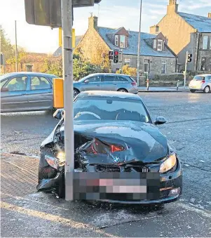  ??  ?? ACCIDENT: A BMW crashed into traffic lights in Broxburn, West Lothian, yesterday