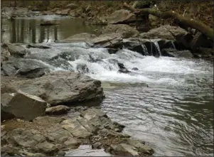  ?? The Sentinel-Record/Corbet Deary ?? CASCADES: Hot Springs Greenway Trail runs alongside Hot Springs Creek, offering several impressive views. The city is acquiring property to extend the multi-use corridor to TV Hill Road.