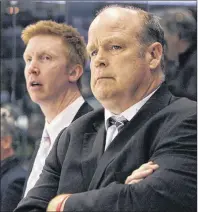  ?? CP PHOTO ?? London Knights general manager Mark Hunter, right, is shown behind the Ontario Hockey League team’s bench in 2014. At left is assistant coach Jeff Paul.