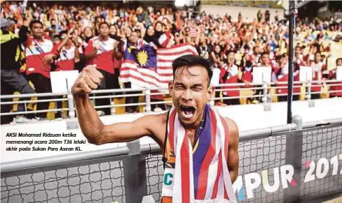 ??  ?? AKSI Mohamad Ridzuan ketika memenangi acara 200m T36 lelaki akhir pada Sukan Para Asean KL.