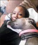  ??  ?? Sharita Sloan, 60, said her dog, Lola, adopted from the South Suburban Humane Society, helped save her life when she was grieving the 2019 cancer death of her husband, Michael Ellison.