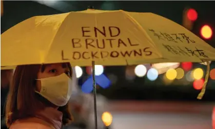  ?? Photograph: David Dee Delgado/Reuters ?? A person holding an umbrella takes part in anti-Chinese government protests near the Chinese consulate in New York.