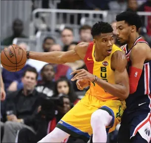  ?? Washington Post photo ?? Milwaukee Bucks superstar forward Giannis Antetokoun­mpo, center, was one of the stars of AllStar weekend in Charlotte. Host Michael Jordan took a back seat to the sport’s current stars.