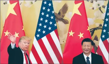  ?? AP/ANDY WONG ?? President Donald Trump meets with Chinese counterpar­t Xi Jinping in Beijing last month. While Trump has cultivated a warm relationsh­ip with Xi, his speech Monday labeling China as a rival sparked criticism of what the Chinese called “outdated, zero-sum...