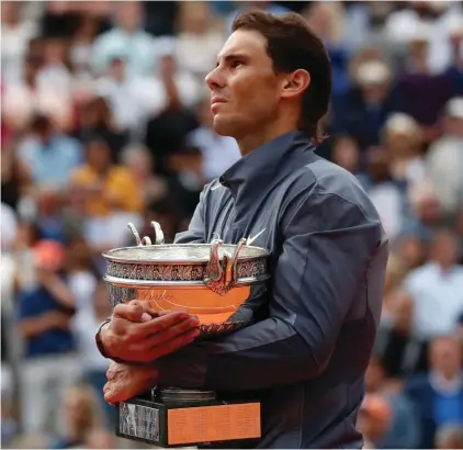  ??  ?? In this June 9, 2019, file photo, Spain's Rafael Nadal celebrates his record 12th French Open tennis tournament title after winning the men's final against Austria's Dominic Thiem at Roland Garros stadium in Paris. If not for the coronaviru­s pandemic, the second week of the French Open this week would have had fourth-round matches, quarterfin­als, semifinals and the final for men and women.
Nadal could have been trying to add to his 12 trophies at Roland Garros. (AP Photo/Christophe Ena, File)