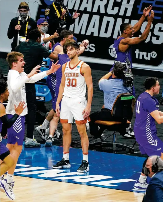  ?? Mark Humphrey / Associated Press ?? Brock Cunningham watches in disbelief after Abilene Christian sank two free throws with 1.2 seconds left to send UT to a fourth straight NCAA opening-round loss.