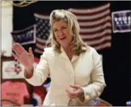  ?? THE ASSOCIATED PRESS ?? Wendy Long, Republican candidate for the U.S. Senate, talks with supporters during a “Women for Trump” rally in Albany Oct. 12 Long has attracted scant attention, relatively little money and, if polls are right, has the slimmest chance of defeating...