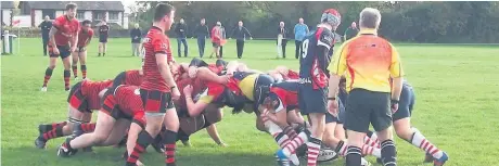  ??  ?? The two packs of forwards get close up and personal during Widnes’s win at Aldwinians.