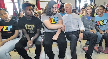  ?? Matthew Hinton Associated Press ?? JOE BIDEN, with participan­ts in New Orleans’ Youth Empowermen­t Project, says he’d spend $1 billion a year on juvenile justice reform.