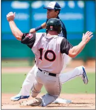  ?? NWA Democrat-Gazette/CHARLIE KAIJO ?? Arkansas Travelers catcher Joe DeCarlo (10) slides into second as Northwest Arkansas Naturals shortstop Nicky Lopez (3) tries to tag him out during the Naturals’ 4-3 victory over the Travelers on Sunday at Arvest Ballpark in Springdale.