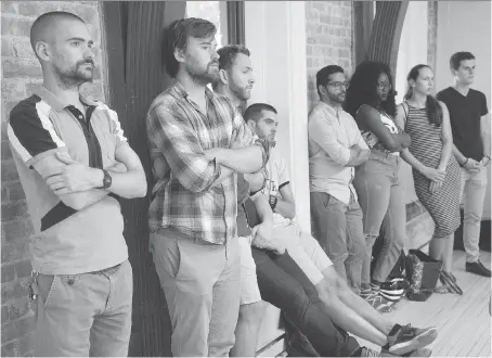  ?? RYAN REMIORZ/THE CANADIAN PRESS ?? Uber staff listen to Jean-Nicolas Guillemett­e, Uber Quebec’s general manager, during a news conference in Montreal on Tuesday. Guillemett­e says the company won’t follow the government’s rule on training drivers, insisting it already delivers...