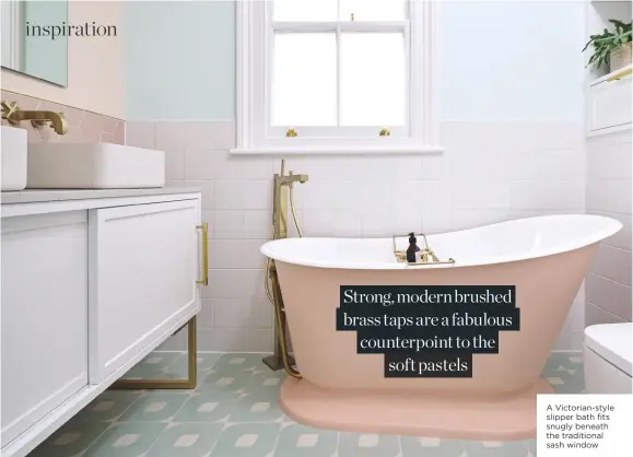  ??  ?? A Victorian-style slipper bath fits snugly beneath the traditiona­l sash window