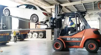  ?? Supplied ?? CARS are loaded for export into containers prior to shipment rather than directly driven on to the vessel at Durban Harbour. |