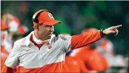  ?? PHOTO BY MATT CASHORE/POOL ?? In this Saturday, Nov. 7 file photo, Clemson coach Dabo Swinney signals to his players during the second quarter against Notre Dame in an NCAA college football game in South Bend, Ind.